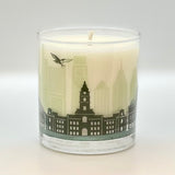 Candle with a cityscape design on a white background